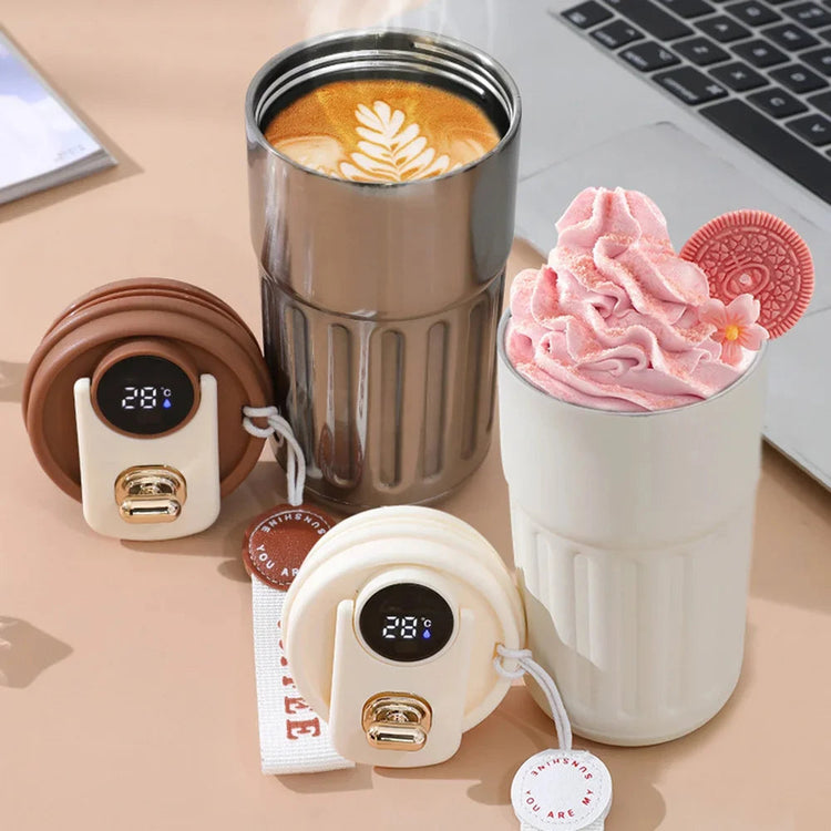 Smart thermos bottle with LED temperature display, stainless steel coffee cup and silicone lid.