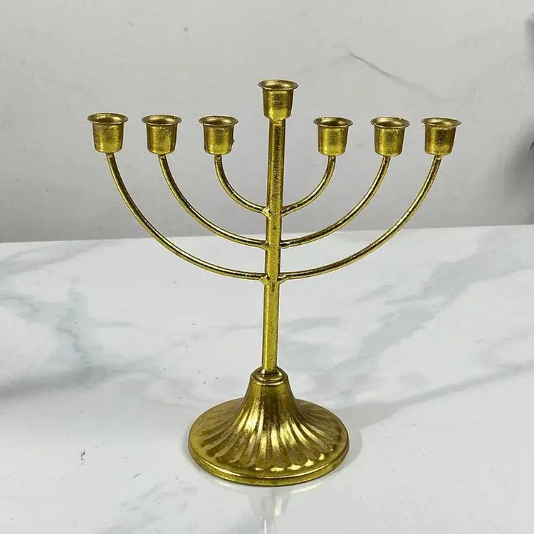 Gold metal Jewish candle holder menorah with seven branches for Hanukkah decoration