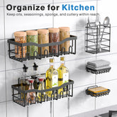 Black adhesive shower caddy set with multiple shelves and holders mounted on kitchen wall organizing bottles, jars, and utensils