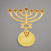 Gold seven-branch Menorah candle holder with Star of David and Hamsa hand design on round base