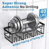 Black stainless steel adhesive shower caddy mounted on tiled wall holding 40-pound weight, no drilling required.