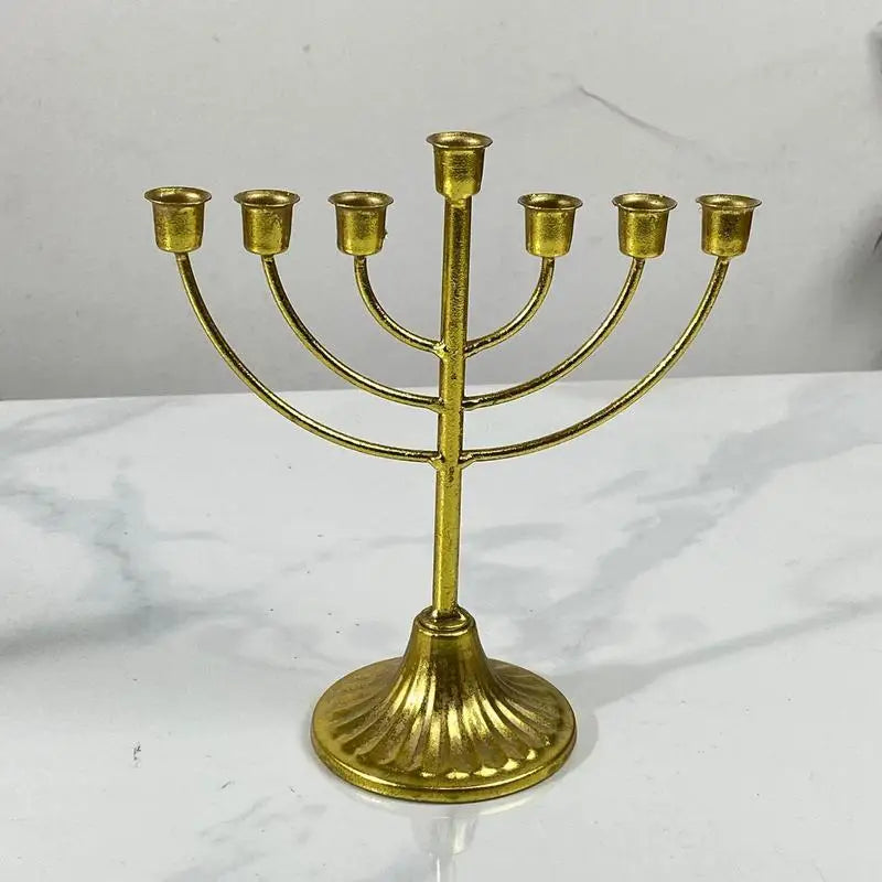 Gold metal Jewish candle holder menorah with seven branches for Hanukkah decoration