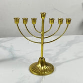 Gold metal Jewish candle holder menorah with seven branches for Hanukkah decoration
